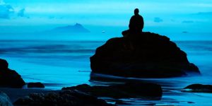 person practicing mindfulness in a serene nature setting