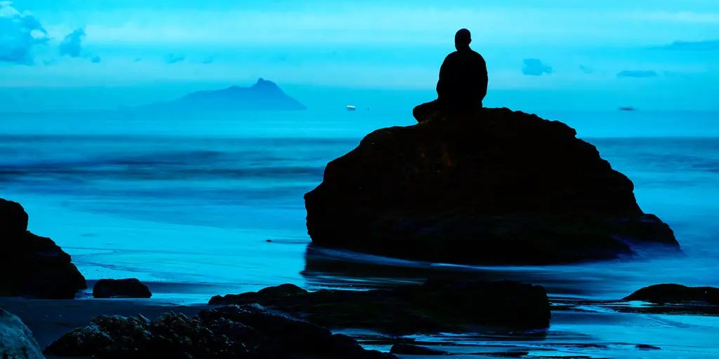 person practicing mindfulness in a serene nature setting